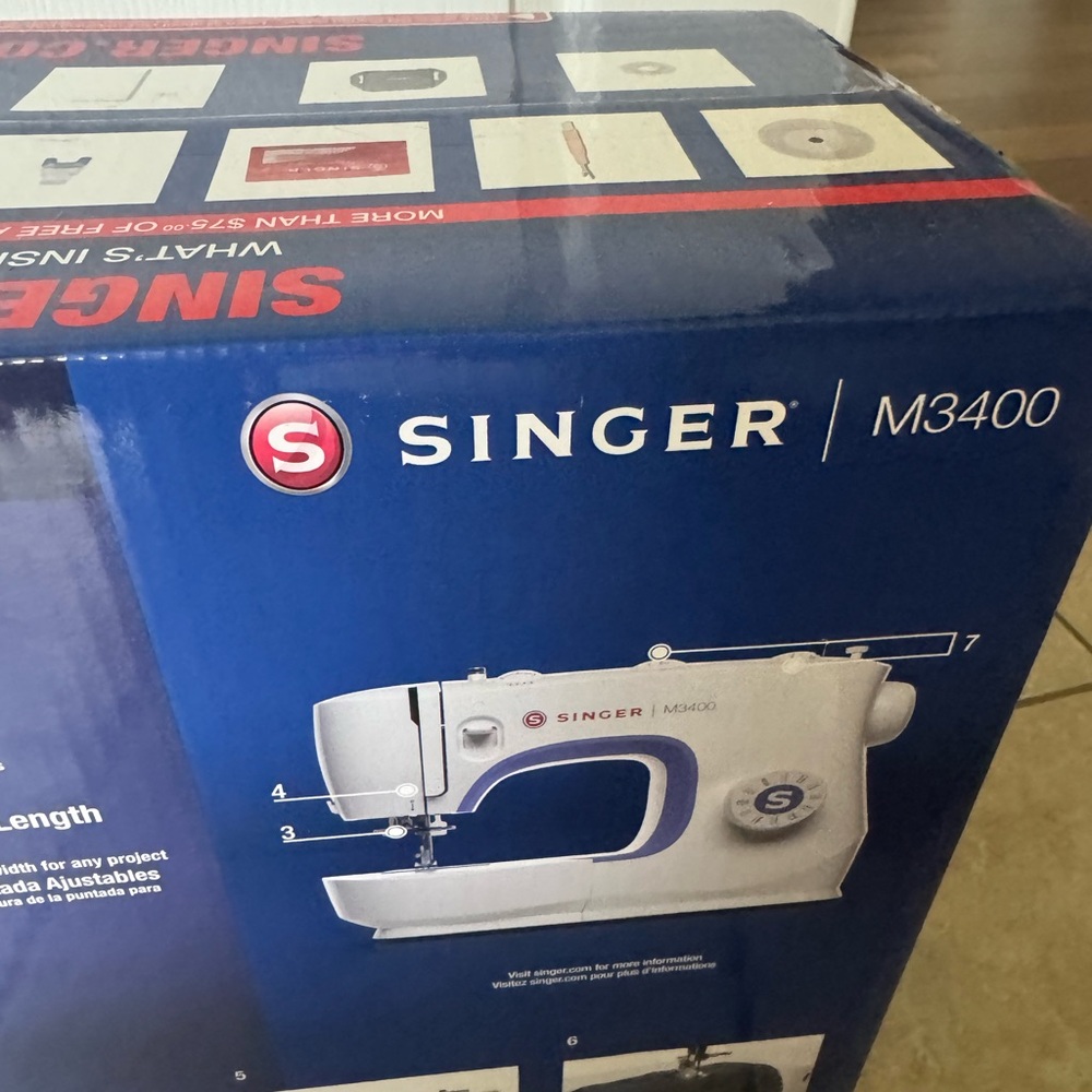 Singer sewing machine, new in box, box never opened